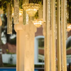 A detailed view of the hanging decor elements. I mixed mini crystal chandeliers with mirrored tassels to create a ceiling installation that sparkled and reflected light beautifully.
