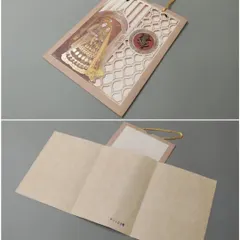 A unique shaadicard with a laser-cut window showing a bride's kalire. The card has a handle for easy carrying and includes a multi-fold insert.