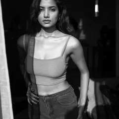 Using the harsh morning sun coming through a window to create strong shadows and highlights. This black and white shot is a great example of playing with natural light for a dramatic effect.