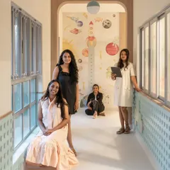 The design team posing in one of the vibrant corridors we designed. This project was a true labor of love, and it's a joy to have these precious memories in the spaces we created together.