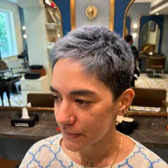 A closer look at the texture and cool ash tone of a very short crop cut. This style is all about precision and creating a shape that is both strong and feminine.