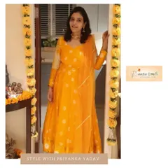 We turned a client's old saree into this bright yellow Anarkali. To complete the look, we added a new dupatta with handmade Gota work for a fresh, festive feel.