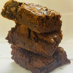 You have to try my famous brownies. I bake them to have a perfectly crisp, crackly top and a super fudgy center that just melts in your mouth.