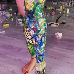 A full leg painted with a collage of abstract shapes and colors. This shows the incredible level of detail and creativity that can emerge when people are given the freedom to use the body as their canvas.