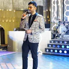 Mic in hand, ready to get the party started at a wedding reception. I move around the stage to engage with guests from all corners, making everyone feel included.