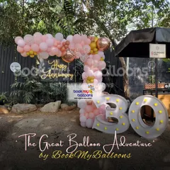 We celebrated a 30th anniversary with this beautiful outdoor setup. The decor featured a "Happy Anniversary" neon sign, light up marquee numbers, and a lovely pink and gold balloon arrangement, creating a romantic and festive ambiance.