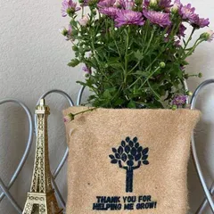 Another one of my favorite designs for thank you gifts. This purple Chrysanthemum is potted in a biodegradable jute bag printed with a tree and the words 'THANK YOU FOR HELPING ME GROW', making it a meaningful present for a mentor or teacher.