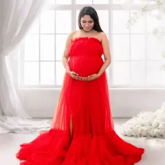 A heavenly, light-filled portrait. Using a bright window, sheer curtains, and a floor of soft clouds, I can make you look and feel angelic in this beautiful red gown.