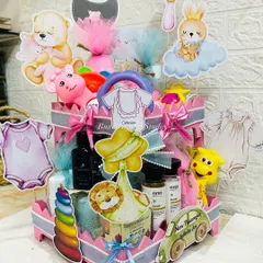This heart-shaped tiered hamper was a joy to create for a baby shower. It's packed with essentials for both the parents-to-be and the new baby, including gourmet treats, premium bath products, and adorable toys.