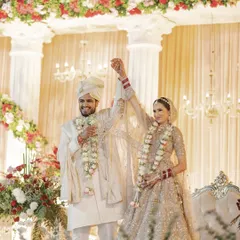 The moment of victory and union. I love capturing the pure, unscripted laughter right after the Varmala ceremony, just like this shot of Vinnet and Stuti celebrating their first chapter of forever.