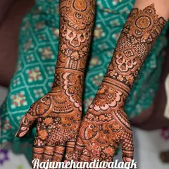 A closer look at the intricate detailing in our bridal mehandi. Notice the clean separation between different patterns, from the delicate paisleys on the palm to the geometric checks on the fingers.