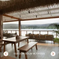 A daytime view of ISSA Goa, a riverside retreat we designed. The space blends Mediterranean and Modern European design with local Goan charm, featuring a hay-thatched roof and an open upper deck with stunning views of the Chapora River.
