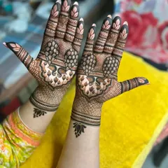 Another view of the detailed peacock design, showing how the pattern extends from the palm to the wrist.
