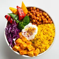 The summer champion. Our humble Shish Tawook Bowl is light yet satisfying, with tender grilled meat, vibrant turmeric rice, and crisp vegetables.
