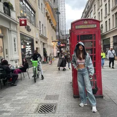 The key to a good travel outfit is comfort and style. This cropped denim hoodie and wide-leg jeans combination is one of my go-tos.