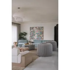 Each piece in the Eden House living room feels special, from the face-designed side tables to the custom gradient bar. It's a collected, eclectic space that reflects the homeowners' personalities.