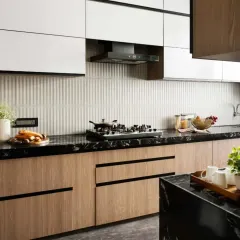 A dream kitchen isn't just about looks, it's about making life easier. This design features a combination of wood-finish and white cabinets with black hardware for a clean, modern aesthetic.