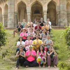Our group practicing yoga together in front of a historic monument. We incorporate yoga and stretching for flexibility, recovery, and mindfulness.