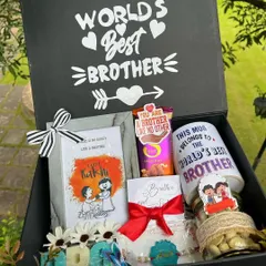 A complete Raksha Bandhan hamper for the "World's Best Brother," including a personalized mug, chocolates, a photo frame, and other goodies in a custom box.