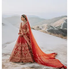 A breathtaking bridal portrait set against a vast, minimalist mountain landscape. This shot highlights our expertise in destination wedding photography, creating epic, magazine-worthy images for our brides.