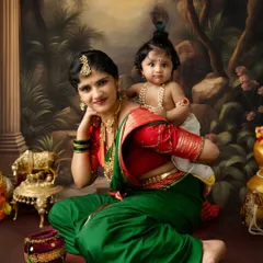 A beautiful portrait of Yashoda and baby Krishna against a painted backdrop of Vrindavan. I offer various backdrops to create an authentic feel for your festive photoshoot.