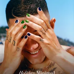 Grooming goes beyond just hair and beards. This image showcases a modern approach to men's manicures with bold, minimalist nail art. It's a form of self-expression that proves attention to detail is everything.