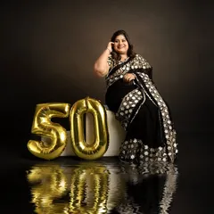 A creative shot using a reflective surface to add an artistic touch to this 50th birthday portrait. I love incorporating creative techniques to make milestone photos unique.