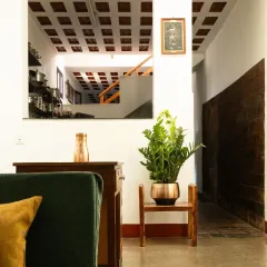 A timeless tribute to heritage. This view highlights the restored waffle slab ceiling and earthy floors, reflecting the architectural wisdom of the Malnad region and blending tradition with modern living.