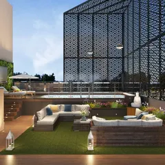 A luxurious rooftop terrace and pool designed for an executive floor in Gurgaon. This space combines leisure and entertainment with a vertical garden, comfortable lounge seating, and a semi-enclosed pool, demonstrating our ability to create exceptional lifestyle environments.