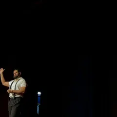 A dramatic moment captured during my TEDx talk. The use of stagecraft and lighting is key to building suspense and focusing the audience's attention, turning a simple presentation into a theatrical experience.