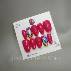 A set of custom press-on nails with an abstract, Picasso-style face painting for a truly artistic statement.