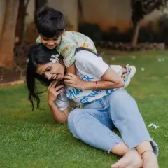 A playful moment on the grass during a mother and son photoshoot. I love capturing the fun and laughter that comes from just enjoying time together as a family.