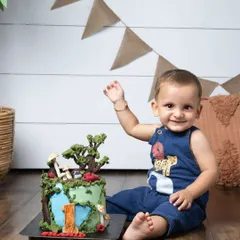 This little one is celebrating his first birthday with a custom cake that tells his unique birth story. I love incorporating personal details to make your shoot truly one-of-a-kind.