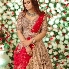 A candid moment showing the soft, romantic makeup and modern jewellery chosen for this reception look. The overall effect is effortlessly elegant.