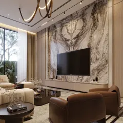 A striking statement wall of veined stone becomes the focal point in this living space. The natural texture speaks of quiet sophistication, while soft furnishings in warm taupe and beige provide a sense of intimacy and comfort.