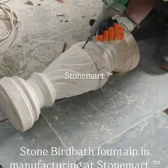 A stone birdbath fountain in manufacturing at Stonemart. This shows the raw form of the pillar before the final shaping and polishing is completed by our skilled craftsmen.