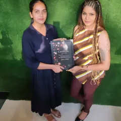 There is no greater reward than seeing my students achieve their goals. Here, I am presenting a certificate of completion, marking the moment a dedicated student becomes a qualified nail professional, ready to start her own career.