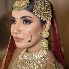 A close-up of my Heritage Bride look. I focused on creating sharp, defined features with bold winged eyeliner and a matte nude lip, letting the magnificent Polki and pearl jewellery shine. This is for the bride who wants to look like pure royalty.