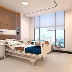 A patient's environment is integral to their recovery. In this private room at AIG Hospitals, we prioritized natural light and expansive city views, creating a serene, comfortable space that feels less clinical and more like a place of rest and healing.
