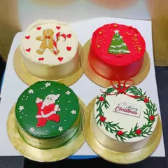 A collection of my mini Christmas cakes, each with a unique design. From a cheerful gingerbread man to a festive wreath, these small cakes are perfect for gifting or for a small family celebration.
