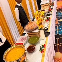 A vibrant and welcoming buffet line for a government unit event. We use decorative elements like flowers and themed tablecloths to match the event's ambiance.