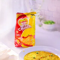 A commercial shot for Saffola Masala Oats, presented in a bright and airy style. The clean lighting and simple presentation make the product look healthy, quick, and delicious.