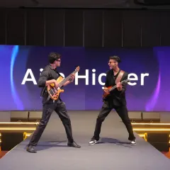 A customized musician flashmob featuring electric guitarists on stage for a corporate awards function. This act was designed to build energy and excitement for the main event.