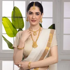 For high-value items like traditional gold jewelry, the visuals must communicate trust and elegance. This model shoot uses soft, clean lighting to highlight the intricate craftsmanship of the necklace set and the model's graceful presence, creating an aspirational look for bridal and festive collections.