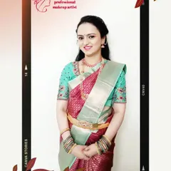 A full-length view of a happy client ready for her wedding ceremony. Her makeup features a soft, natural base with defined eyes, paired with a beautiful silk saree and traditional jewellery.