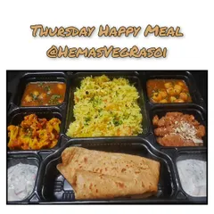 My Thursday Happy Meal is a complete, balanced vegetarian thali that brings the comfort of home to your office. It includes Paneer Pulao, Raita, Chole, Gobi, Parathas, and a sweet Sheera made with pure ghee.