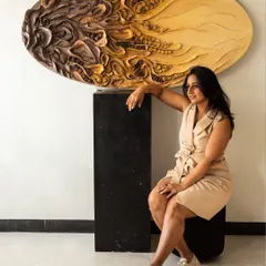 This piece is 'The Enchanted Abyss,' a 60-inch oval sculpture made from upcycled paper and mixed media. It's a piece that shaped me as much as I shaped it.