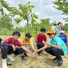 School boys planting a sapling at one of our sites. When children plant a tree themselves, they become its guardian and develop a sense of responsibility towards nature.