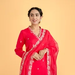 For this ethnic wear brand, we created a vibrant studio lookbook. This image highlights the intricate embroidery and bright color of the garment, using controlled lighting and a warm, complementary background to make the product the hero of the shot.