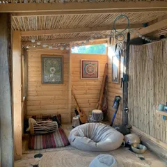 The cozy, rustic meditation space for our yoga retreat in Italy. We create a simple, sattvic atmosphere conducive to deep practice and relaxation.
